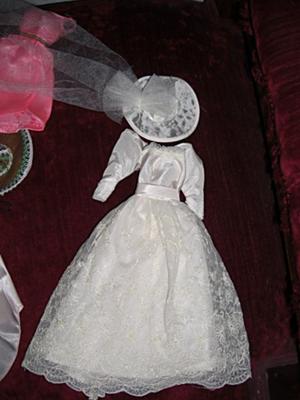 Hello I have a puffy shouldered tagged barbie wedding dress with a hat veil Hello I have a puffy shouldered tagged barbie wedding dress with a hat veil