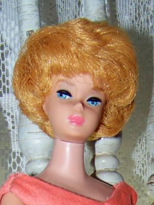 Barbie with Coral lips marked Barbie (R)pats pend (C)with all the letters and numerals by Mattel inc