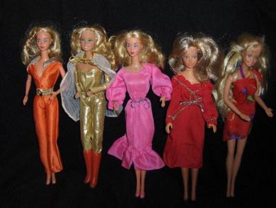Six Barbie Dolls